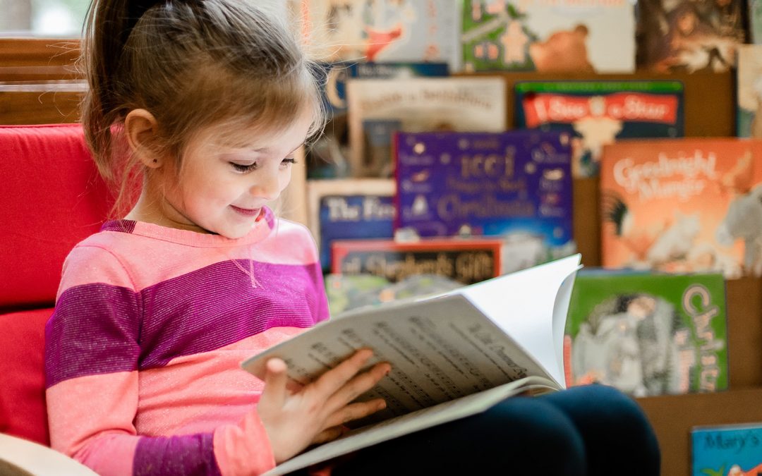 girl in pink reading